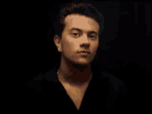 a blurry picture of a man 's face in a black shirt