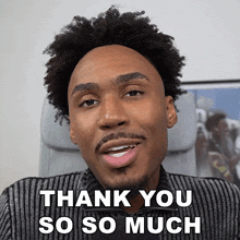a man says thank you so so much in front of a picture