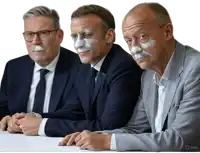 three men are sitting at a table with their faces painted with white paint