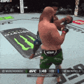 a fighter wearing green shorts with the word venom on them