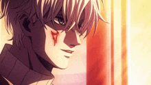 a close up of a man 's face with blood on it