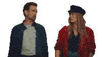 a man and woman standing next to each other on a white background