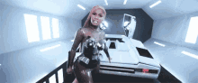 a woman in a futuristic outfit is standing next to a car in a room .