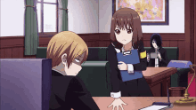 a girl holding a clipboard with the letter b on it is standing next to a boy