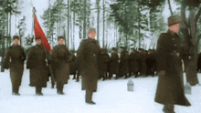 a group of soldiers marching in the snow