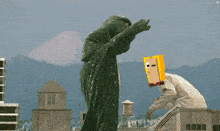 a man with a yellow box on his head is standing next to another man