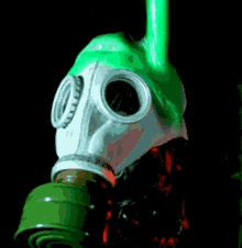 a person wearing a gas mask is standing next to a green pipe