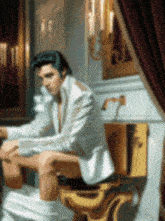 a painting of elvis presley sitting on a gold toilet