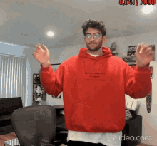 a man wearing a red hoodie that says " nothing matters "