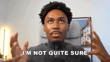 a man is sitting in a chair and says i 'm not quite sure .