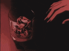 a woman is pouring a drink into a glass .