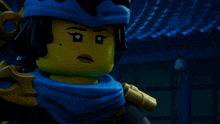 a close up of a lego character with a scarf around her neck
