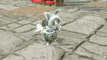 a white and blue cat is standing on a brick floor