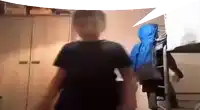a person in a black shirt is standing in front of a closet