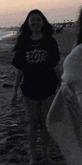 a girl wearing a black shirt that says zor