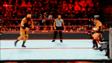 two wrestlers are fighting in a ring with a referee in the background