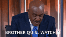 a bald man in a suit and tie is saying brother quis watch it .