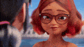 a cartoon girl with red hair and glasses is smiling .