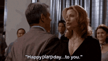 a man and a woman are standing next to each other and the woman is saying " happy plarpday ... to you " .
