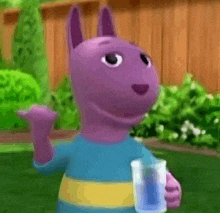 a purple cartoon character is holding a glass of water and waving at the camera .