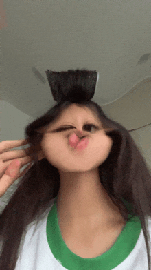 a girl making a funny face with her hair
