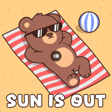 a teddy bear wearing sunglasses is laying on a beach towel with the words " sun is out " below it