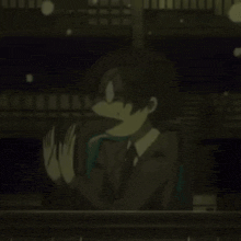 a man in a suit and tie is making a funny face while looking out a window .