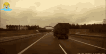 a truck is driving down a highway with a tear coming out of its mouth
