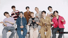 a group of young men are posing for a photo with a timer that says 00 01 2 15