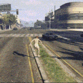 a man in a pink shorts is running down a street
