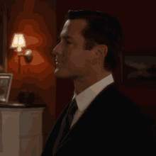 a man in a suit and tie says " no "