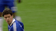 a soccer player wearing a blue shirt with a samsung logo on it