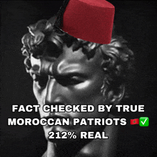a picture of a statue with a red hat on it