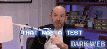 a man sitting in front of a microphone with the words that was a test dark web