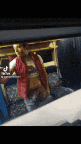 a tiktok video of a man taking a picture of himself on a train