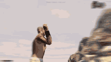 a video game screen shows a man with a tattoo on his arm and the words " dubai ocean highway "