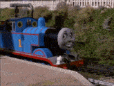 a blue train with the number 1 on the front of it