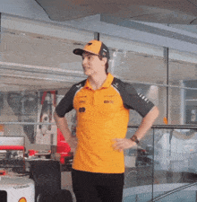 a man wearing a yellow shirt that says dhl on it