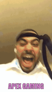 a man with a headband on his head and the words apex gaming behind him