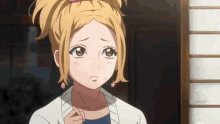 a close up of a girl with a ponytail and earrings