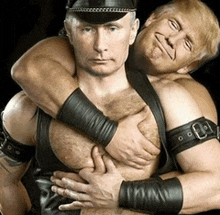 a man in a hat is hugging another man