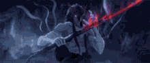 a person is holding a purple sword in their hand in a dark forest .