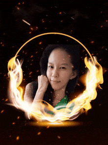 a woman is surrounded by a circle of fire