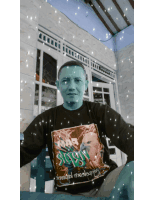 a man wearing a black shirt with a picture of a man and the word war on it
