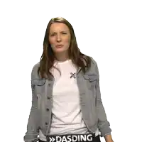 a woman wearing a denim jacket and a white shirt with the word dasding on her belt