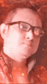 a close up of a person wearing glasses and a red jacket .