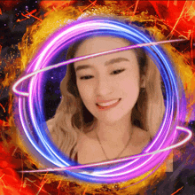 a woman 's face is surrounded by a purple and blue circle