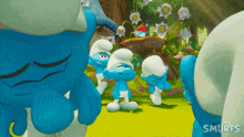 a group of smurfs standing in a field with the word smurfs on the bottom