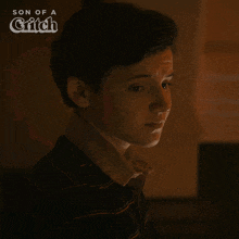 a boy says no in front of a son of a critch logo