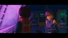 two lego characters are standing next to each other in a dark room